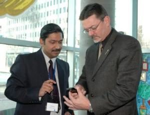 Dr. Kinshuk Demonstrates Cell Phone Technology to Technology Minister Doug Horner
